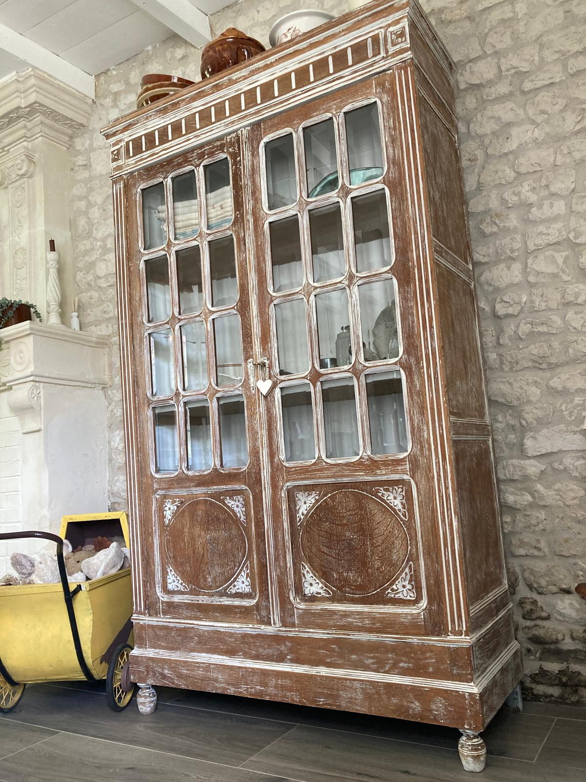 Tall French glazed bookcase cabinet with limed oak finish and carved panels